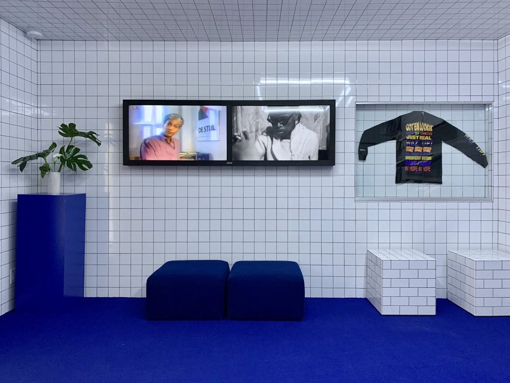 Image of shop room with tiled walls and blue floor