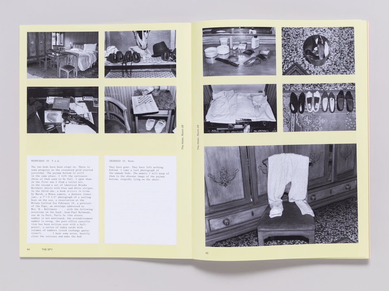 An open book with black and white photographs on each page agains a light yellow background