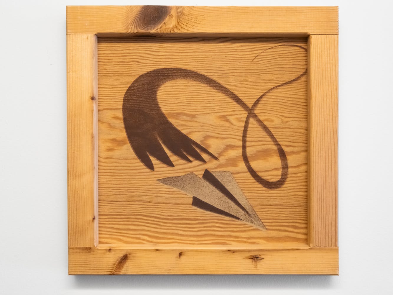 A wood square peice of art with an illustration of