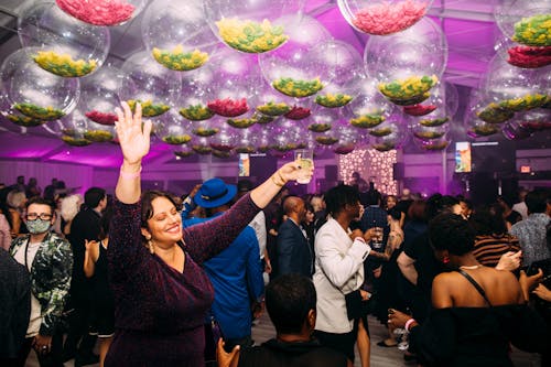 Peopel partying in a decorated room during Party in the Garden