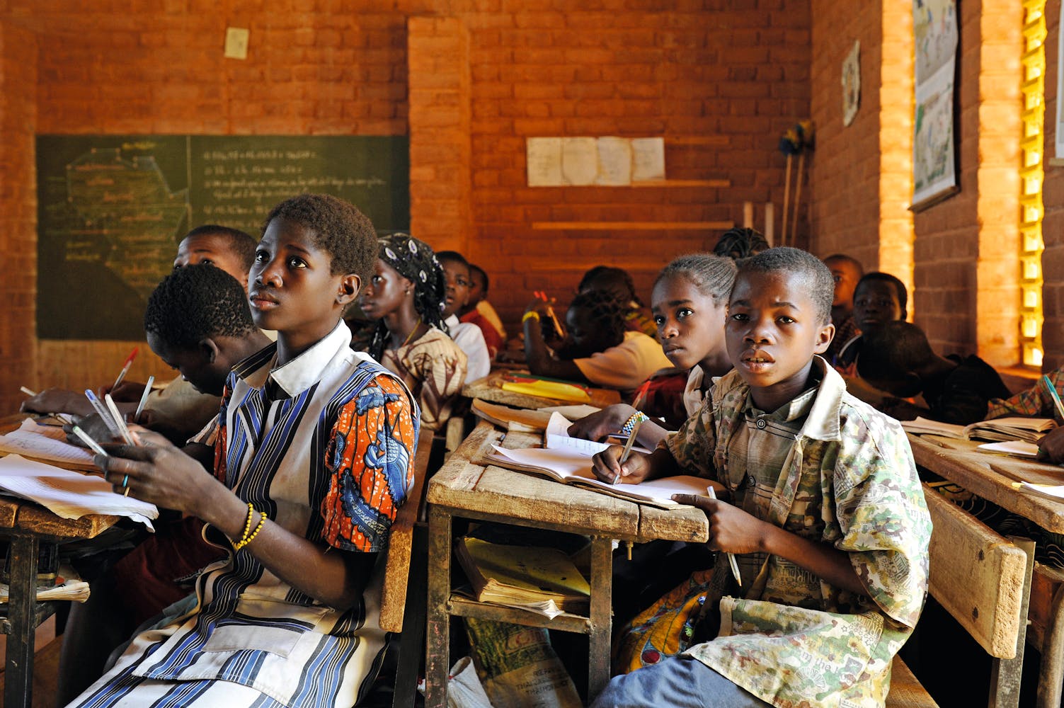 students sitting at desks in classroom
