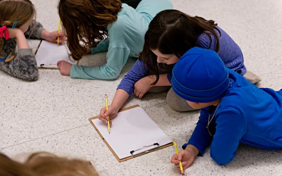 children drawing in a gallery