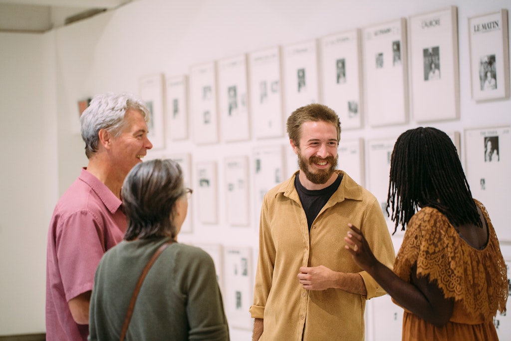 Photo of a group of people in a gallery.