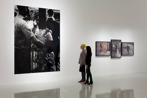 View of the exhibition Radical Presence: Black Performance in Contemporary Art, 2014; (left to right): Adam Pendleton with Jaan Evart and Marc Hollenstein, Black Dada (Ian Berry, couple dancing, independence celebration Congo, 1960), 2008/2012; Clifford Owens, Anthology (Glenn Ligon), 2011