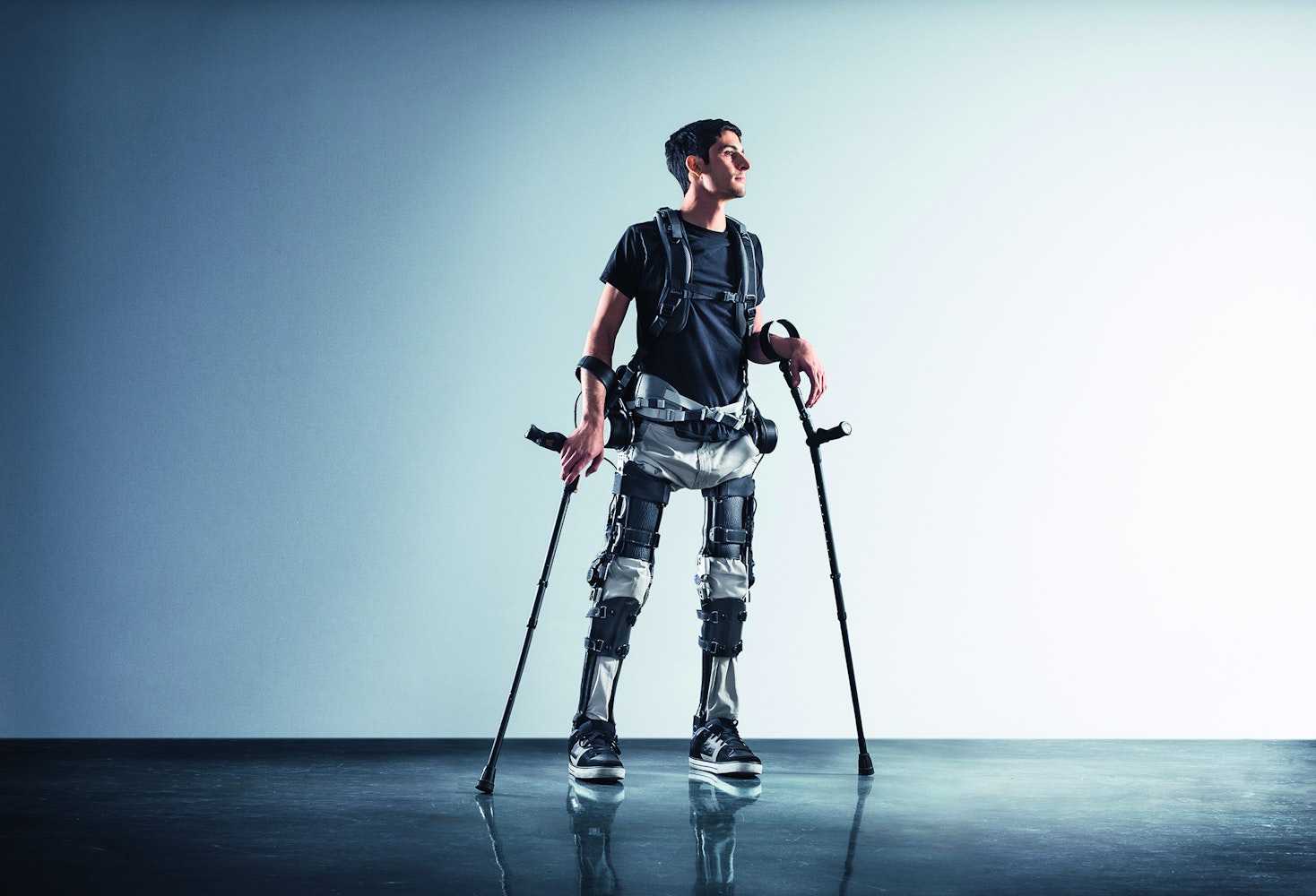An image of a man wearing an exoskeleton and braces.