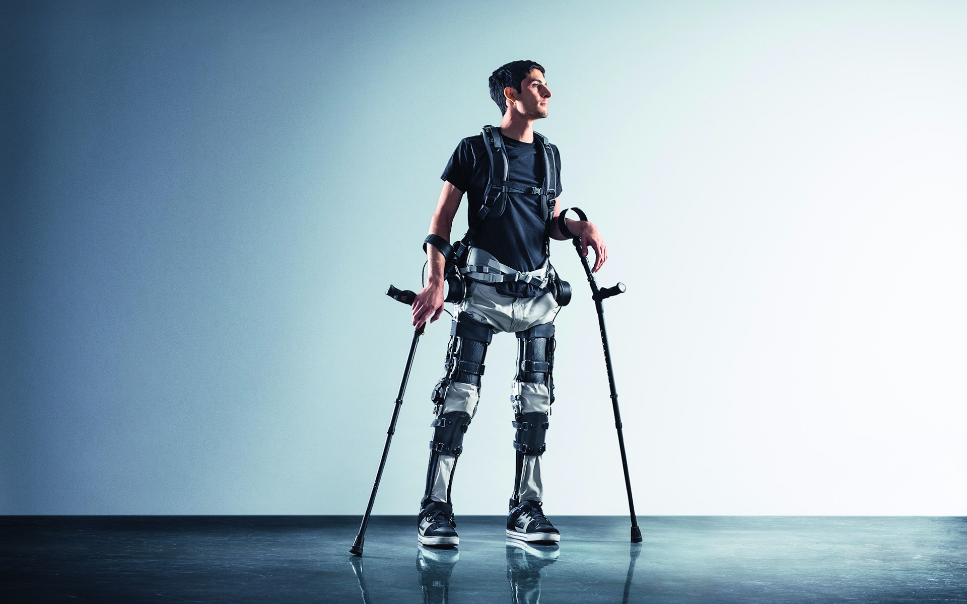 An image of a man wearing an exoskeleton and braces.