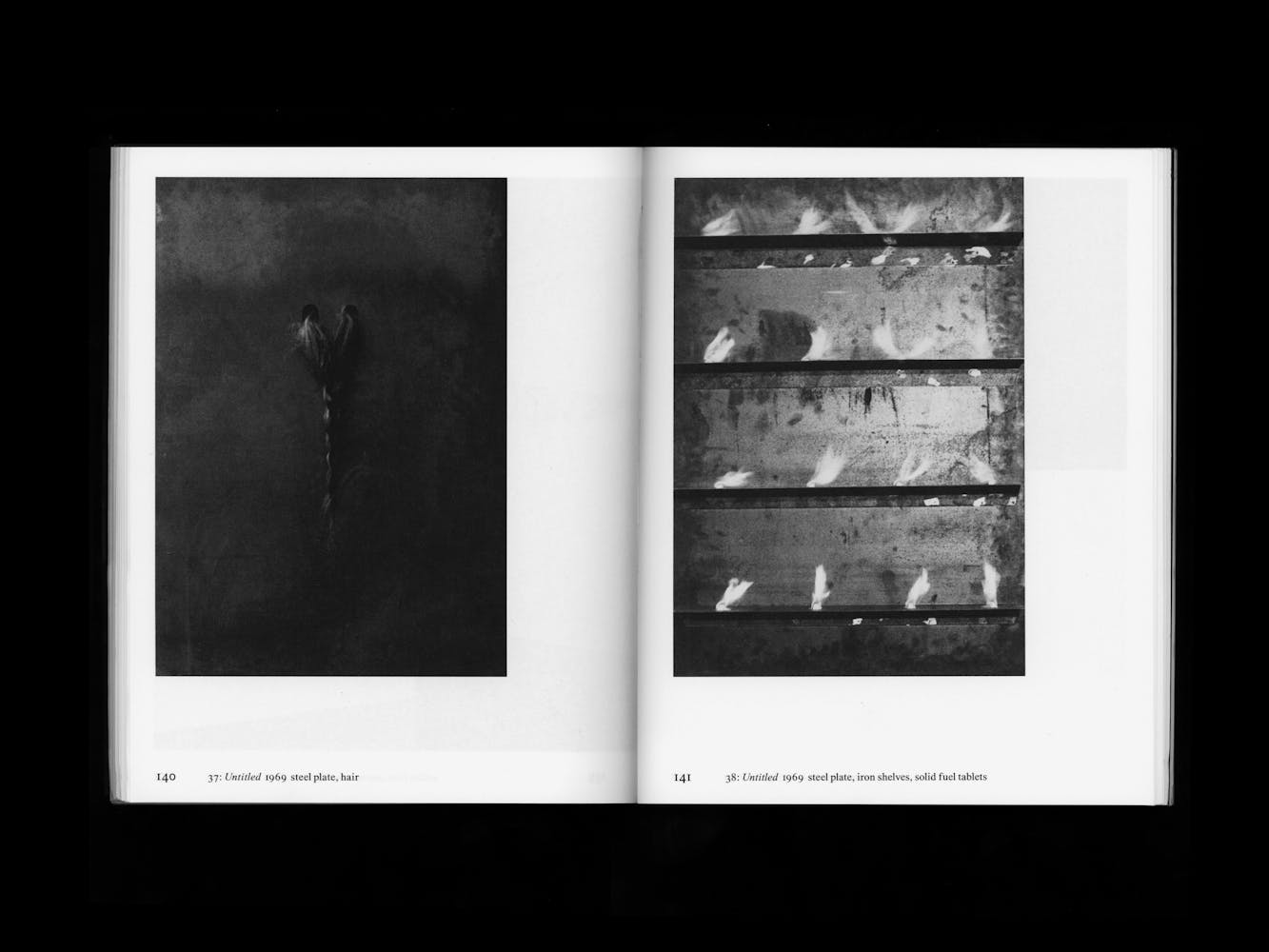 Spread of a book with pictures of artwork.