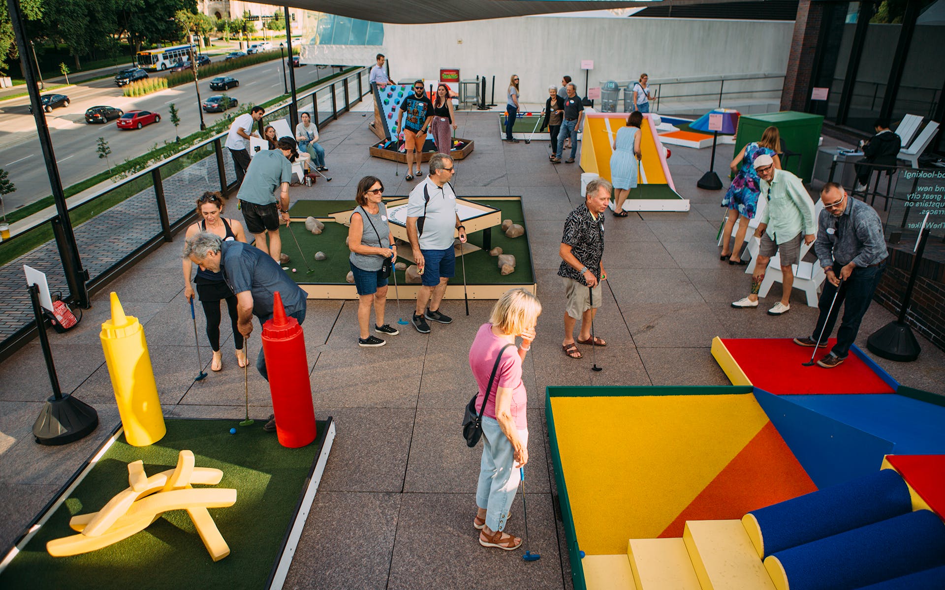 People playing Skyline Mini Golf on the Terraces