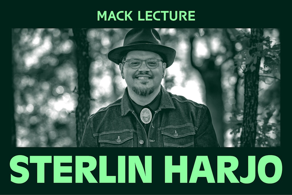 A black and white photograph of an adult with medium dark skin, wearing a fedora hat and glasses smiling at the viewer. Green text above and below image reads Mack Lecture and STERLIN HARJO.
