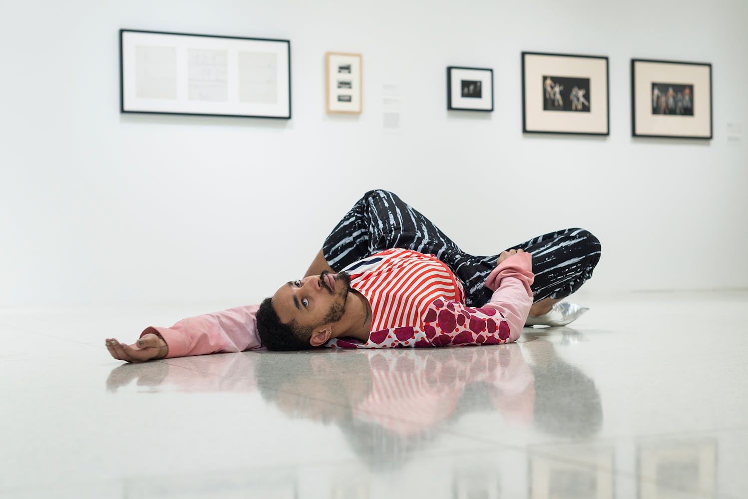 View of the exhibition Merce Cunningham: Common Time, 2017; Maria Hassabi, STAGING: solo, 2017 performed by Niall Jones (Photo: Thomas Poravas, ©Walker Art Center)