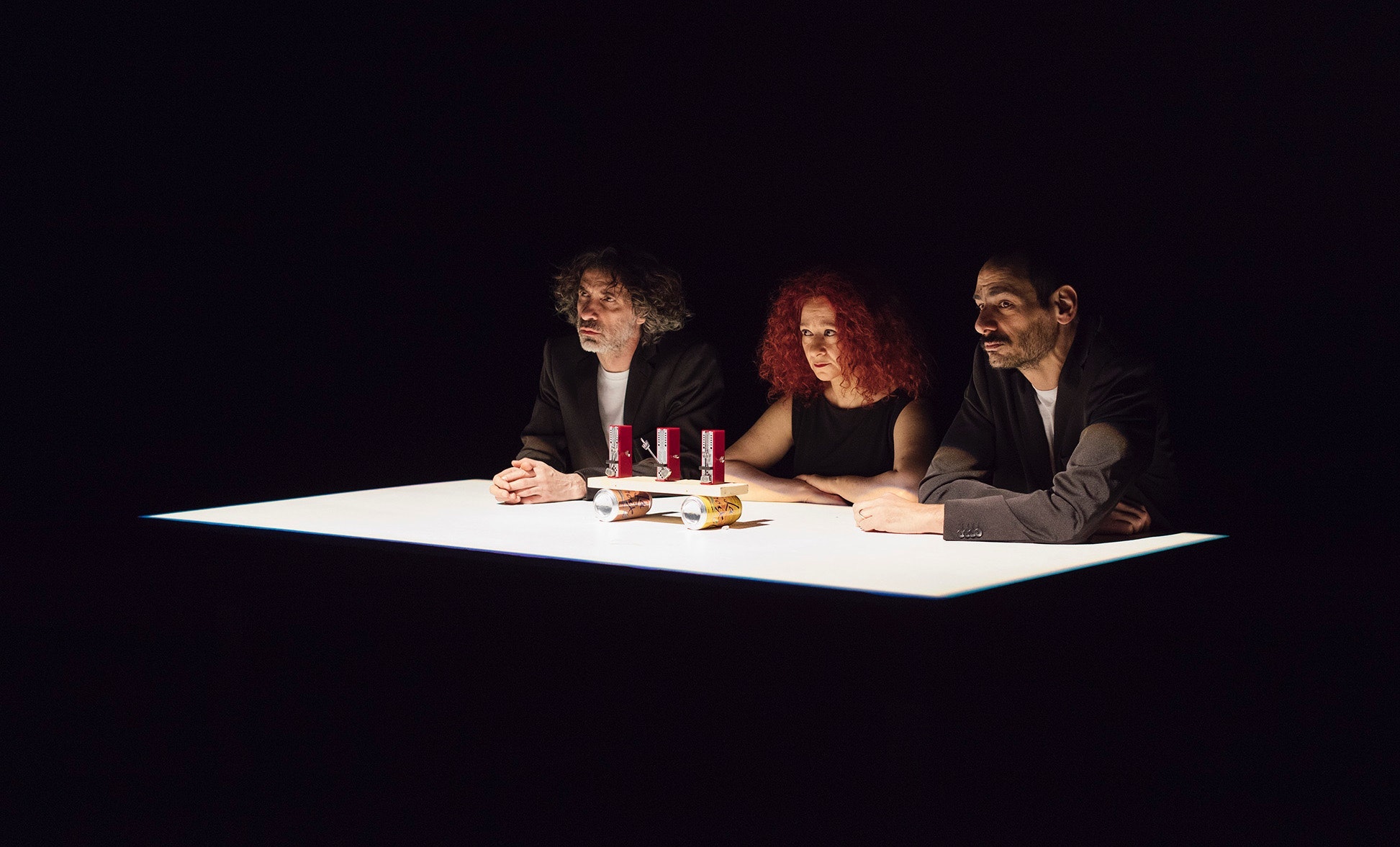 Three people sitting at a table