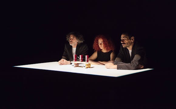 Three people sitting at a table