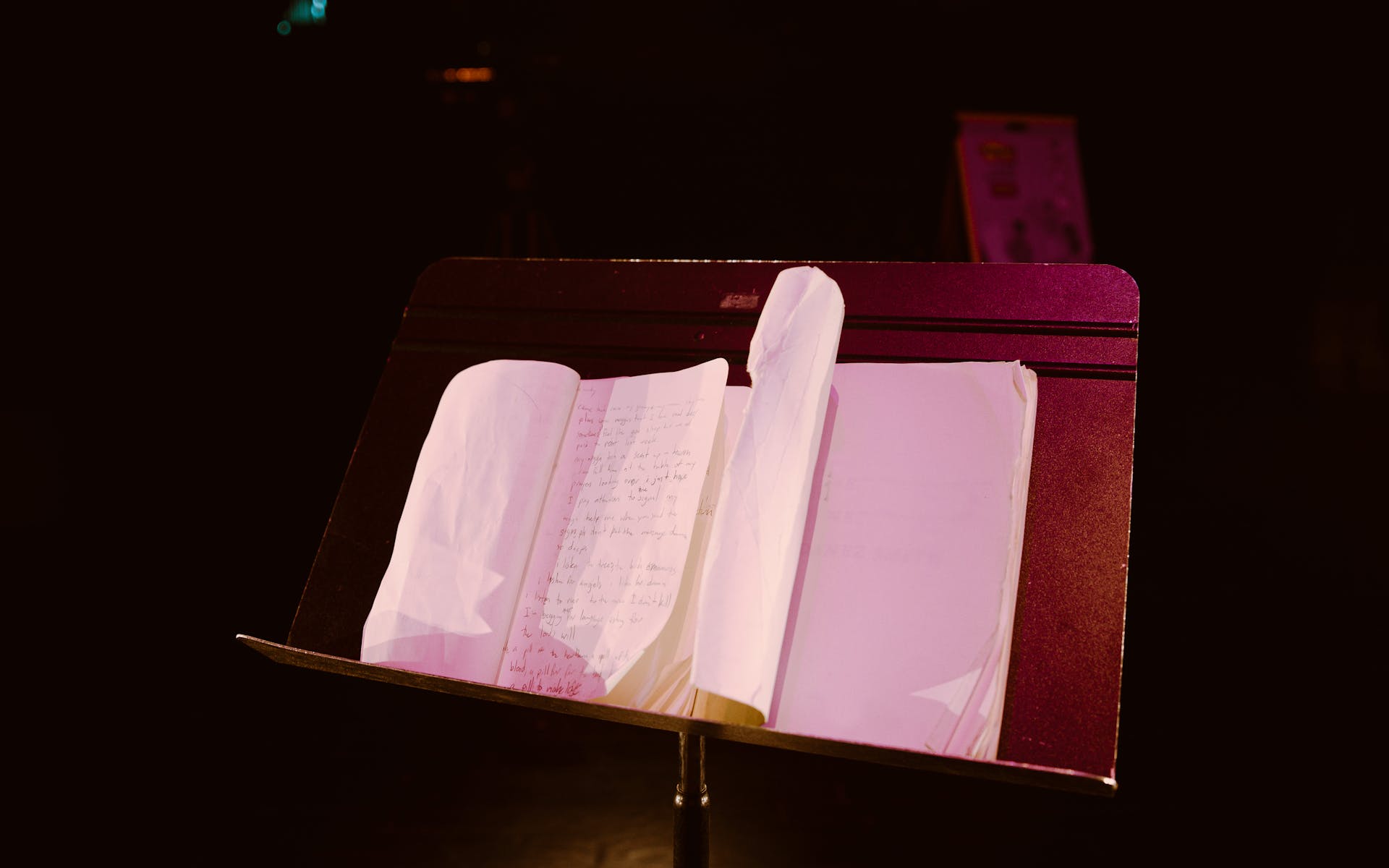 Notes in a book sit on a music stand