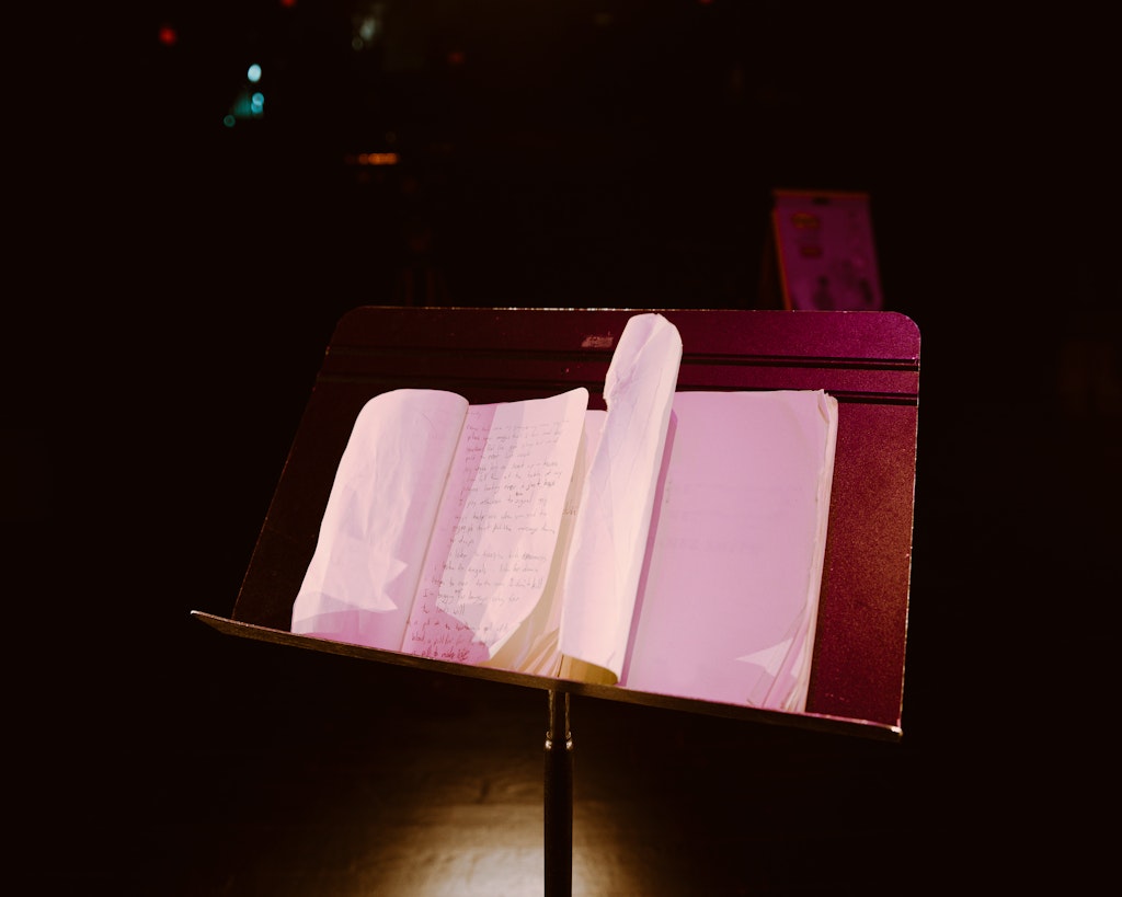 Notes in a book sit on a music stand