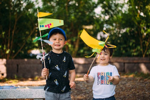 Two children holding flags they made