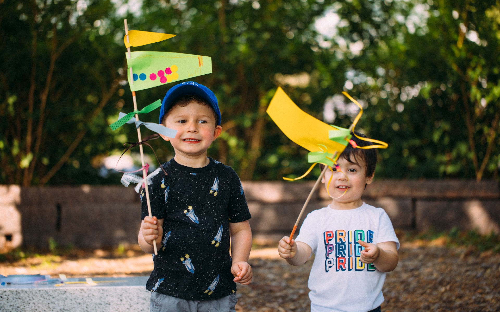 Two children holding flags they made