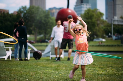 Child playing with a hula hoop