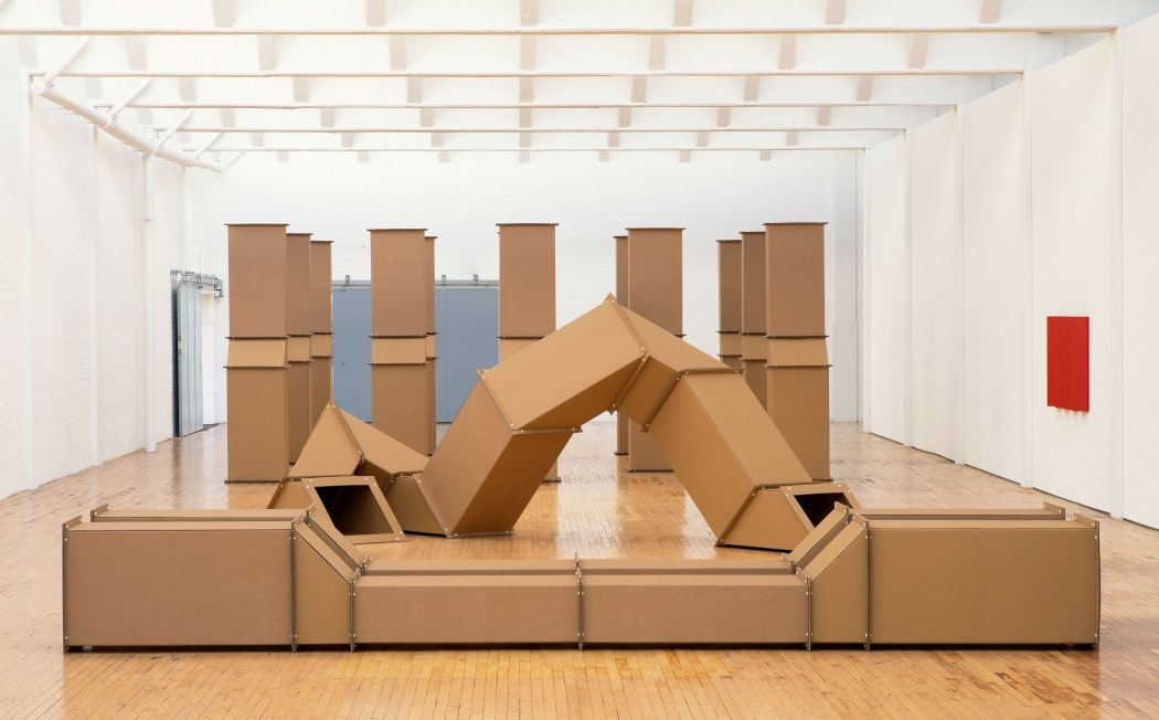Cardboard ventilation systems are arranged in a gallery space.