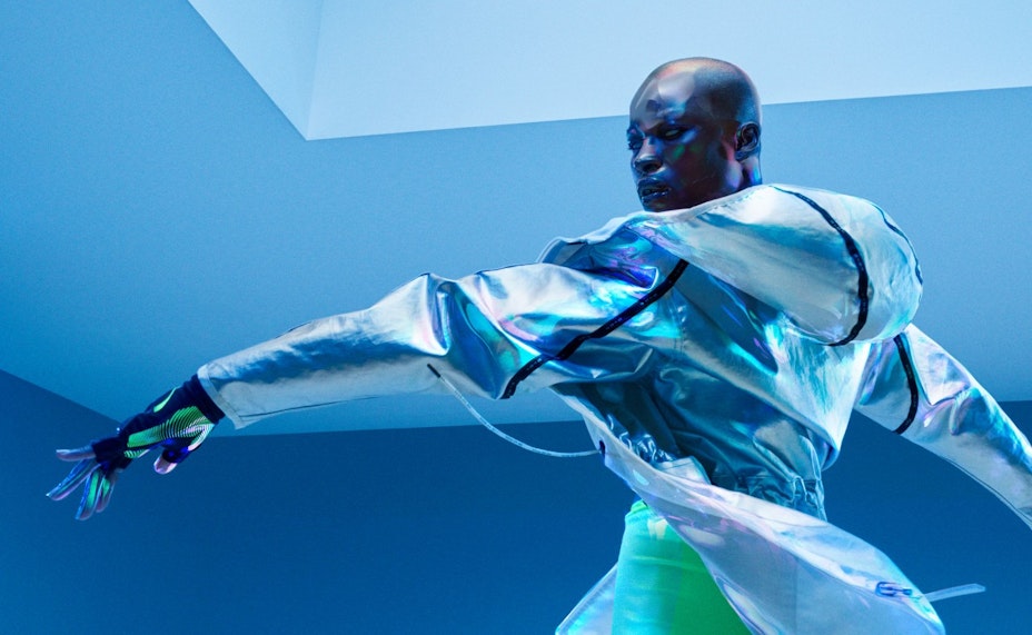 An adult poses wearing Nike sportswear