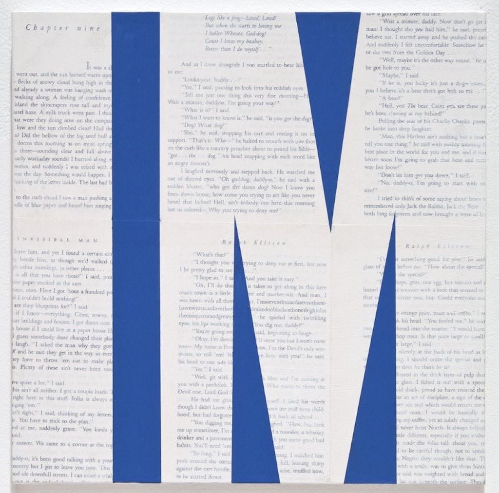 The letters I M over layed on a page of printed text.