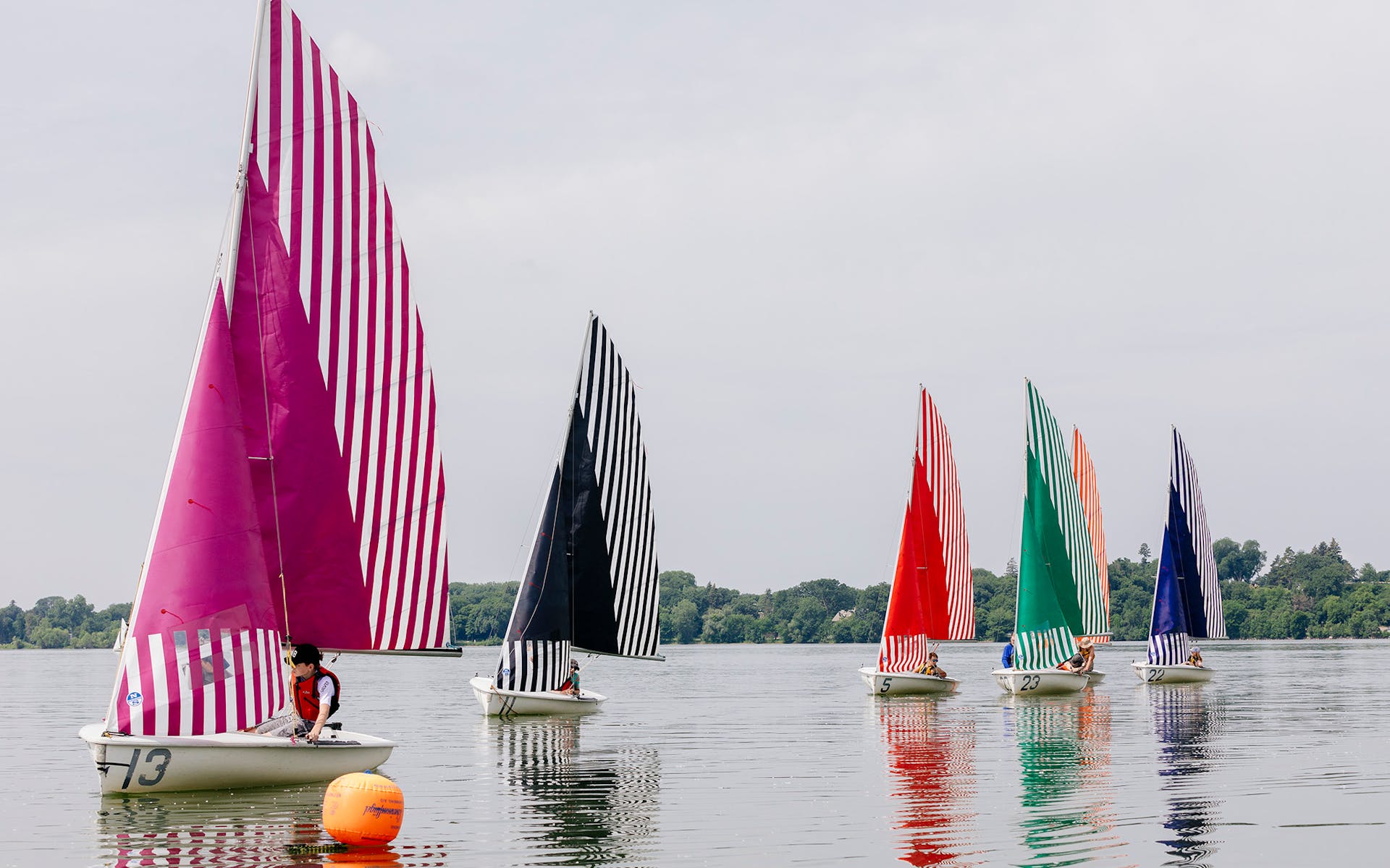 Daniel Buren's sails on sailboats in Lake Bde Maka Ska