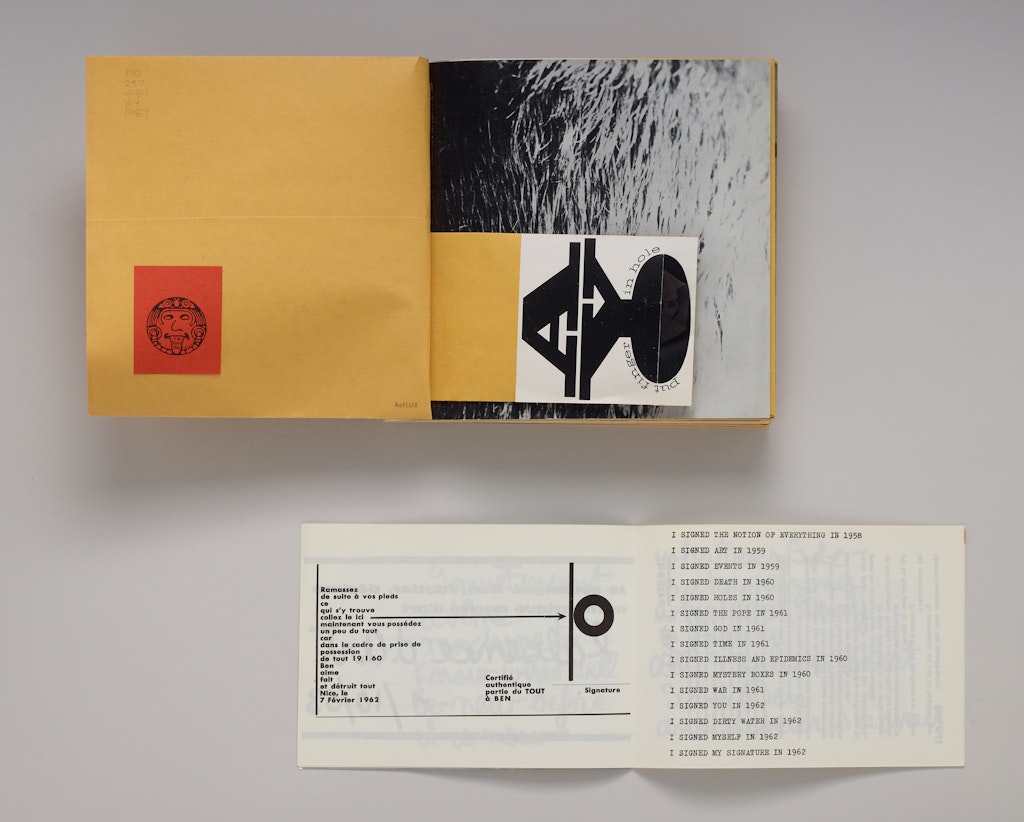 Two open books on a table top.