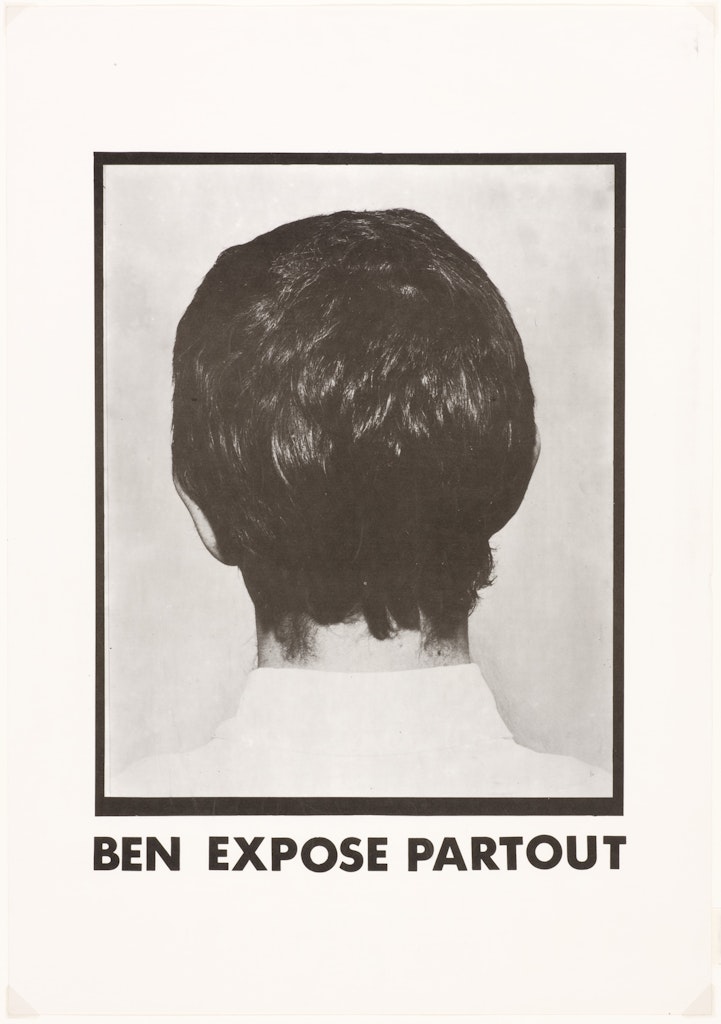 A black and white photo of the back of an adults head, short dark brown hair. 