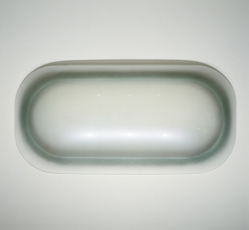 A gray and white oblong object.